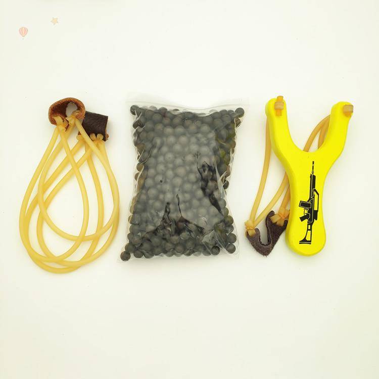 Yellow slingshot + 500 mudballs + 2 skin bands